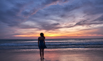 girl at sunset by the sea