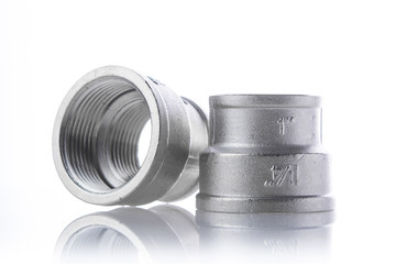 metal fittings over white background