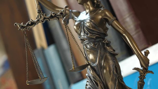 Symbol of Justice with Books. Tribunal and justice concept. Consultation with insurance lawyer and customer