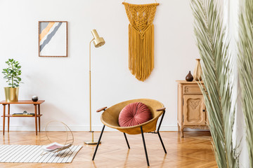 Stylish and elegant scandi home interior of living room with gold armchair, retro design...