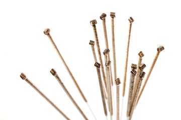 Silver needles for traditional Chinese medicine acupuncture. Close-up. Isolated on white background.