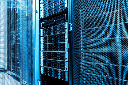 Close Up Inside Data Server Room. High Capacity Hard Drive Disk Storage Rack. Blade Server In Datacenter.