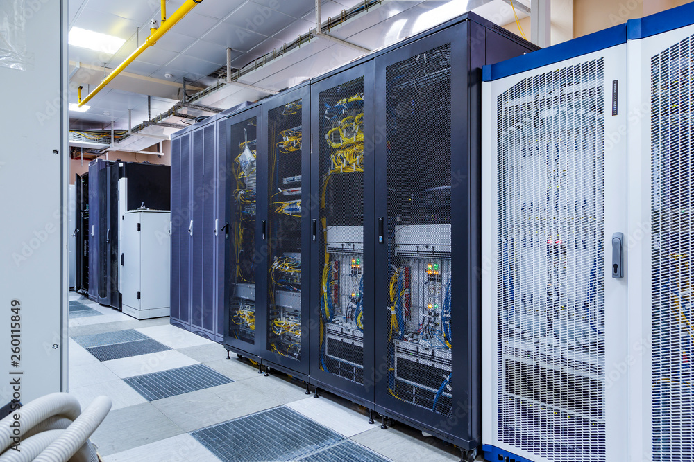 Poster control modules with modern communication equipment, switches and cables in server room. data center