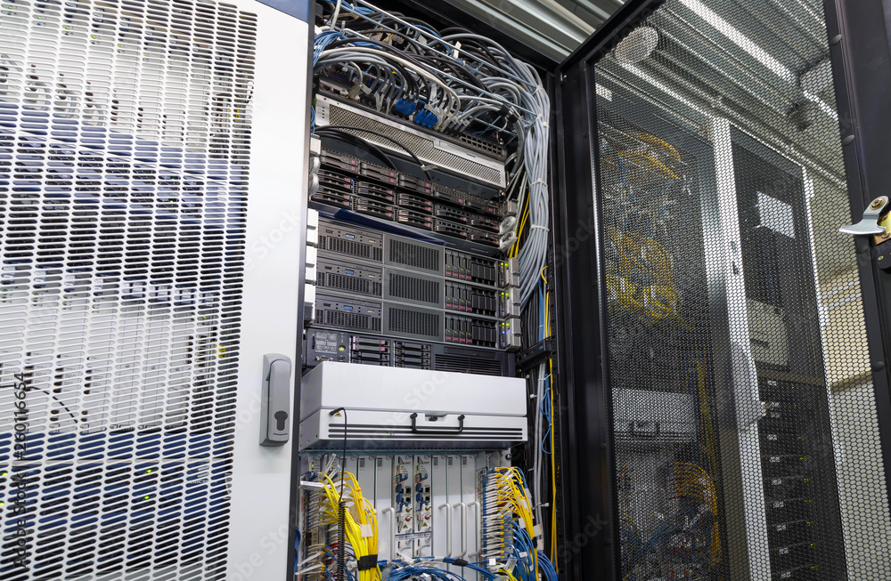 Poster server rack in big data center inside close up. supercomputer with hardware, storage blades, cables 