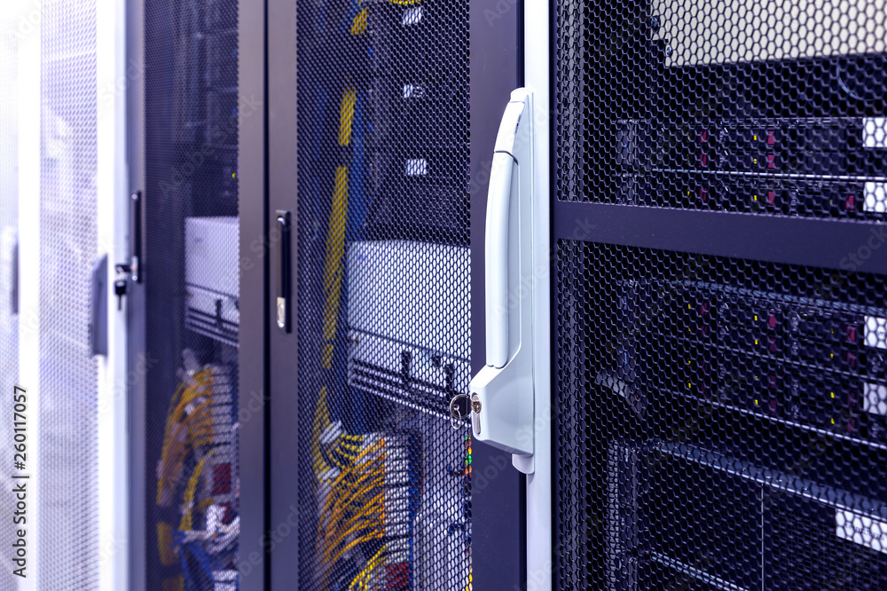 Poster row of racks in big data center inside close up. datacentre interface and equipment.