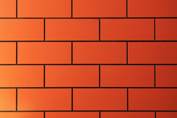 Orange bricks pattern on wall for abstract background
