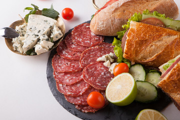 cold meat dish and sandwiches
