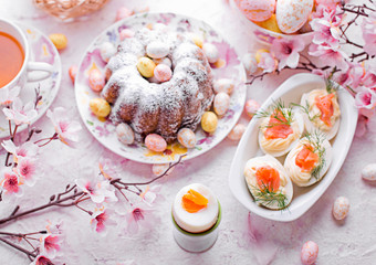 Easter breakfast.Cake and eggs with salmon