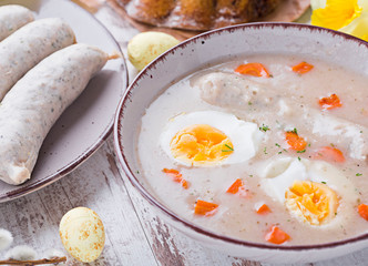 Easter breakfast. Sour rye soup with eggs and sausage