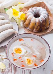 Easter breakfast. Sour rye soup with eggs and sausage