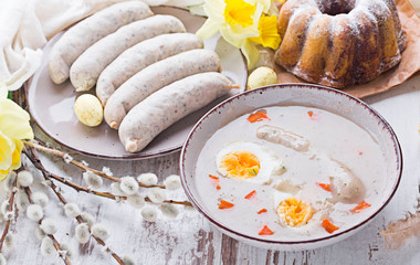 Easter breakfast. Sour rye soup with eggs and sausage