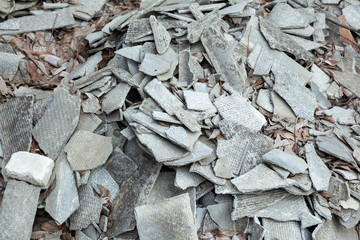 A pile of broken pieces of corrugated slate.