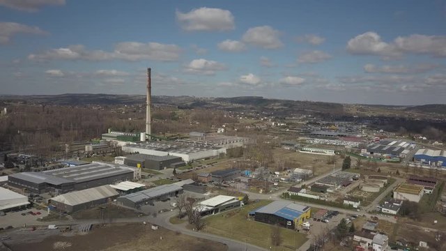 Gorlice, Poland - 3 9 2019: Industrial region of the Carpathian city. Top view of the refinery and auxiliary buildings. Video shot by drone or quadrocopter. Vanity of the day at the factory. Planning 