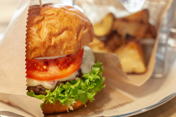 tasty burger set. hamburger with patato at background. launch fastfood.