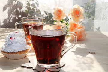 A cup of tea and a cake on a sunny table, a bouquet of spring flowers for mood, diet food and a healthy lifestyle in the village, a beautiful morning in the village, a delicious dessert