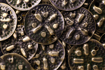 Vintage metal buttons. Old decorative metal design elements background.