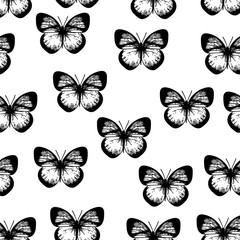 Seamless black and white pattern of butterflies on white background.
