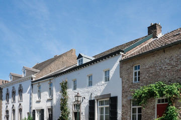 Fototapeta na wymiar street with white houses in Eijsden, The Netherlands