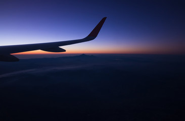 Sunrise on window plane wiew, with mountains on the background in the region of Cancun