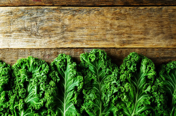 Fresh kale Bunch on a dark wood background