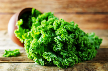 Fresh kale Bunch on a dark wood background