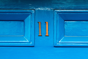 House number 11 with the eleven in metal numbers