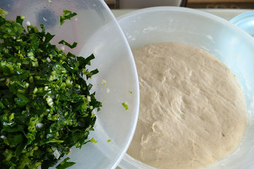 woman making dough with rolling pin, woman making dough with spinach,