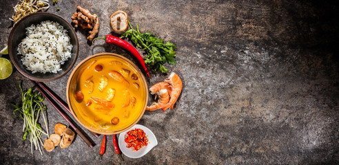 Top view composition of Thai prawn in yellow curry