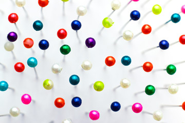 Sewing pins. Colorful sewing pins background. Close Up of sewing pins with multi colored heads. Part of set.