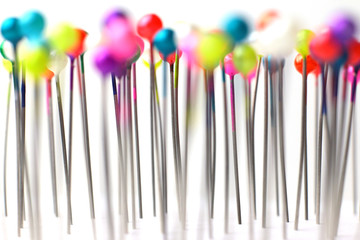 Sewing pins. Colorful sewing pins background. Close Up of sewing pins with multi colored heads. Part of set.