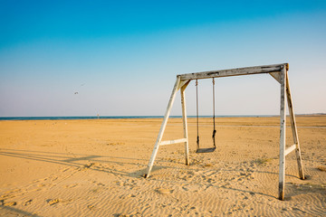 swing on beach of  Lido di Spina, Italy