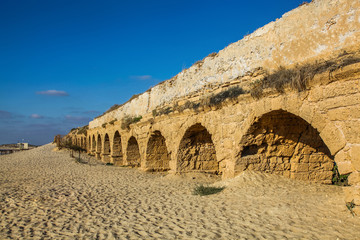 Ruins of an ancient Roman aqueduct along the beach near Caesarea Israel