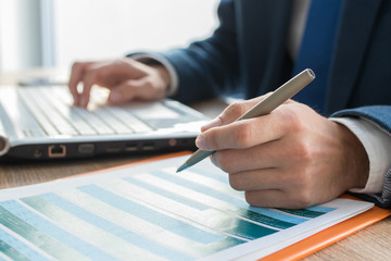 business man hands with computer on desktop