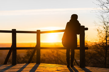 Lonely woman at sunrise. Solitude concept, alone in forest