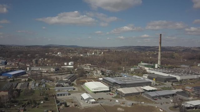 Gorlice, Poland - 3 9 2019: Industrial region of the Carpathian city. Top view of the refinery and auxiliary buildings. Video shot by drone or quadrocopter. Vanity of the day at the factory. Planning 