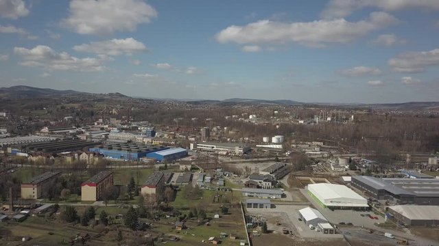 Gorlice, Poland - 3 9 2019: Industrial region of the Carpathian city. Top view of the refinery and auxiliary buildings. Video shot by drone or quadrocopter. Vanity of the day at the factory. Planning 