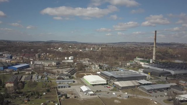 Gorlice, Poland - 3 9 2019: Industrial region of the Carpathian city. Top view of the refinery and auxiliary buildings. Video shot by drone or quadrocopter. Vanity of the day at the factory. Planning 
