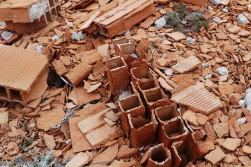 rotten concrete and bricks, use of poor quality materials in construction,