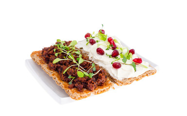 Healthy food. Rye crisps with young green sprouts.