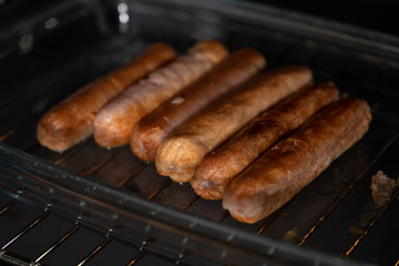 sausages on the grill