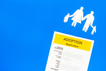 Family and adoption child concept with application on blue background top view mockup