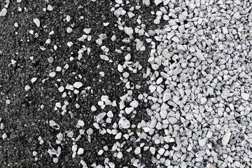 pitch and pebbles on asphalt road, close-up,
