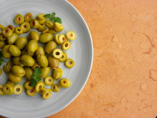 green olives on wooden table