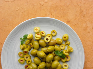 green olives on wooden table