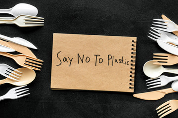 Say no to plastic copy. Eco concept and injunction on the use of plastic flatware on black...
