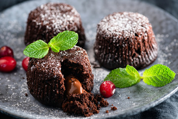 Chocolate Cakes With Molten Core Decorated With Mint Leaf. Closeup View. Lava Chocolate Cake