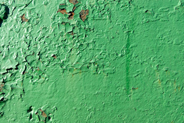 Green paint texture on old stone and iron