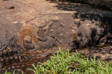 Lord Vishnu in a reclining repose lying on the serpent god Ananta, with Goddess Lakshmi at his feet...