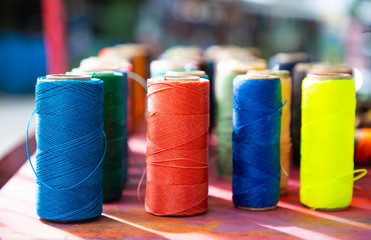 Colorfull twine rolls on a market for sale in the caribbean