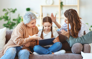 Fototapeta na wymiar child with tablet on the Internet, Internet addiction, parents scold